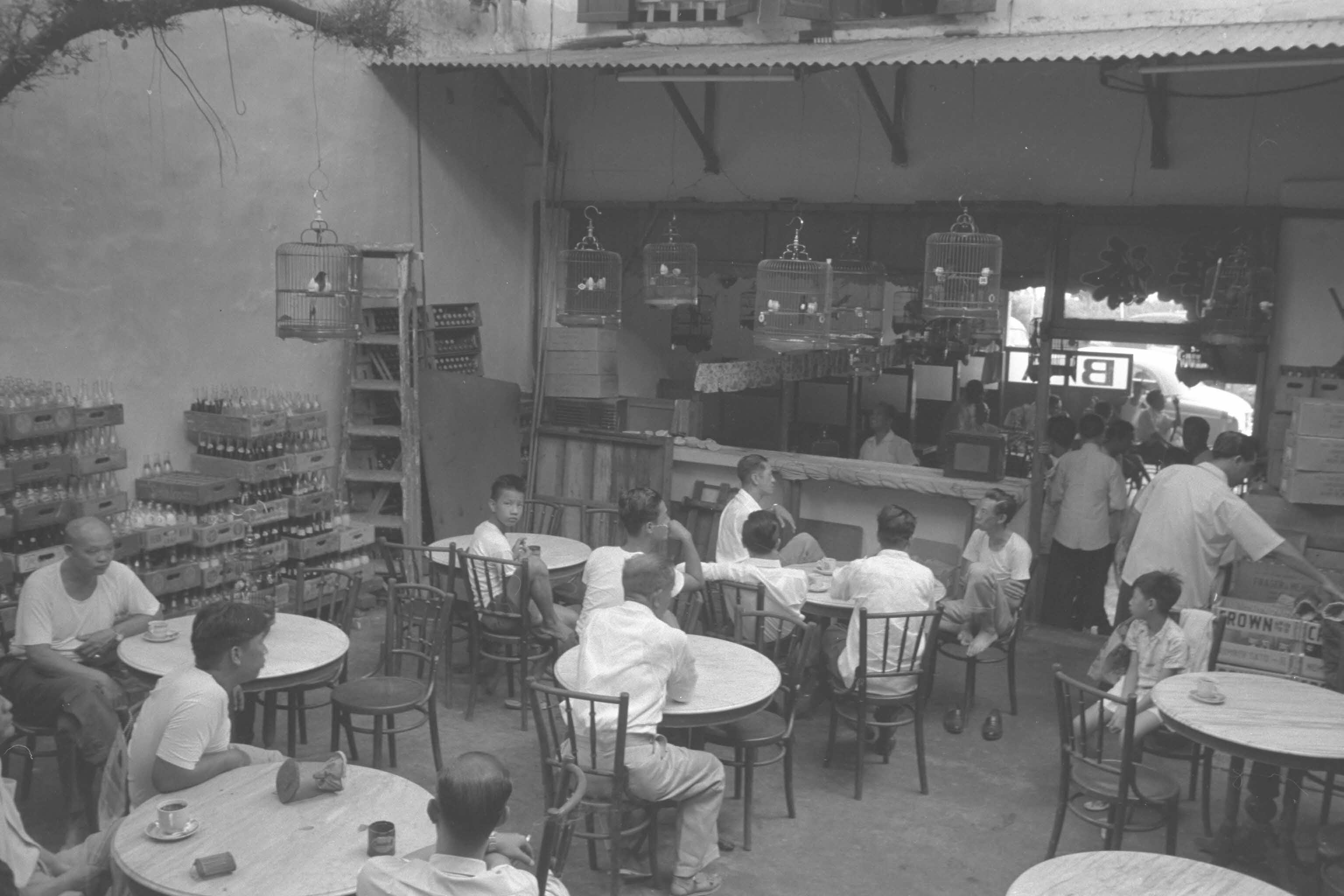 Coffee shop in Chinatown with bird singing corner, 1965.